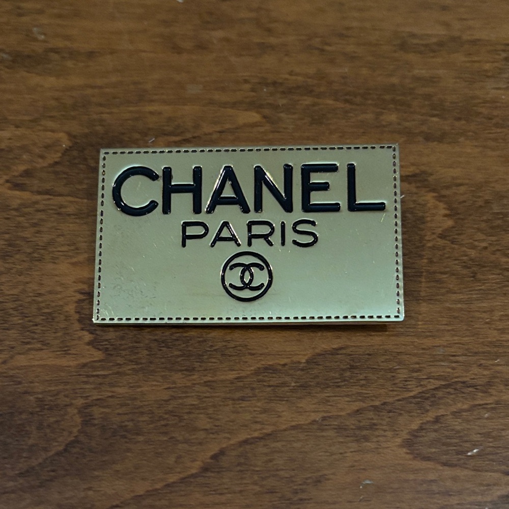 CHANEL Gold and Black Logo Plaque